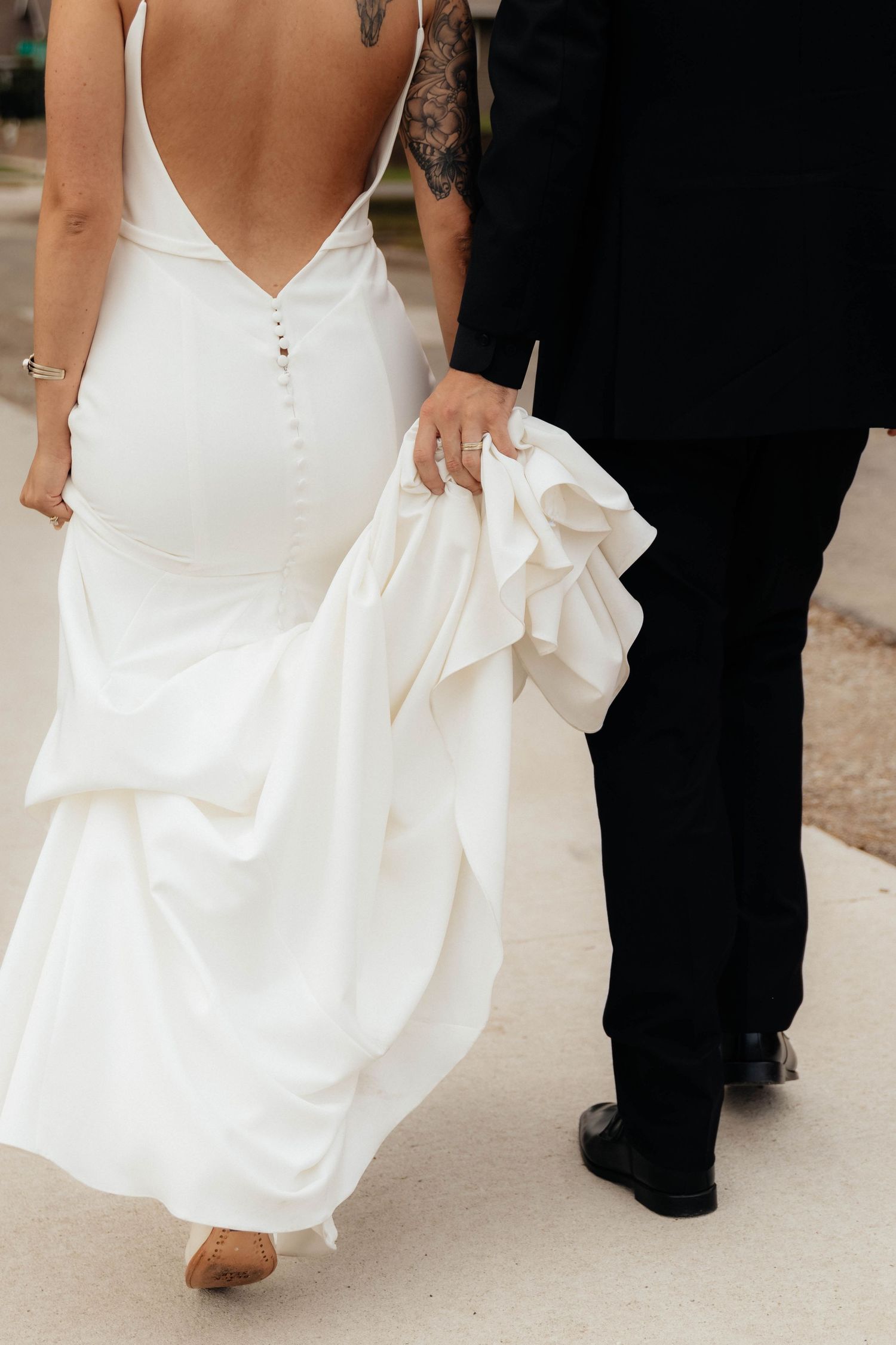 Close-up of bride and groom walking on their wedding day.