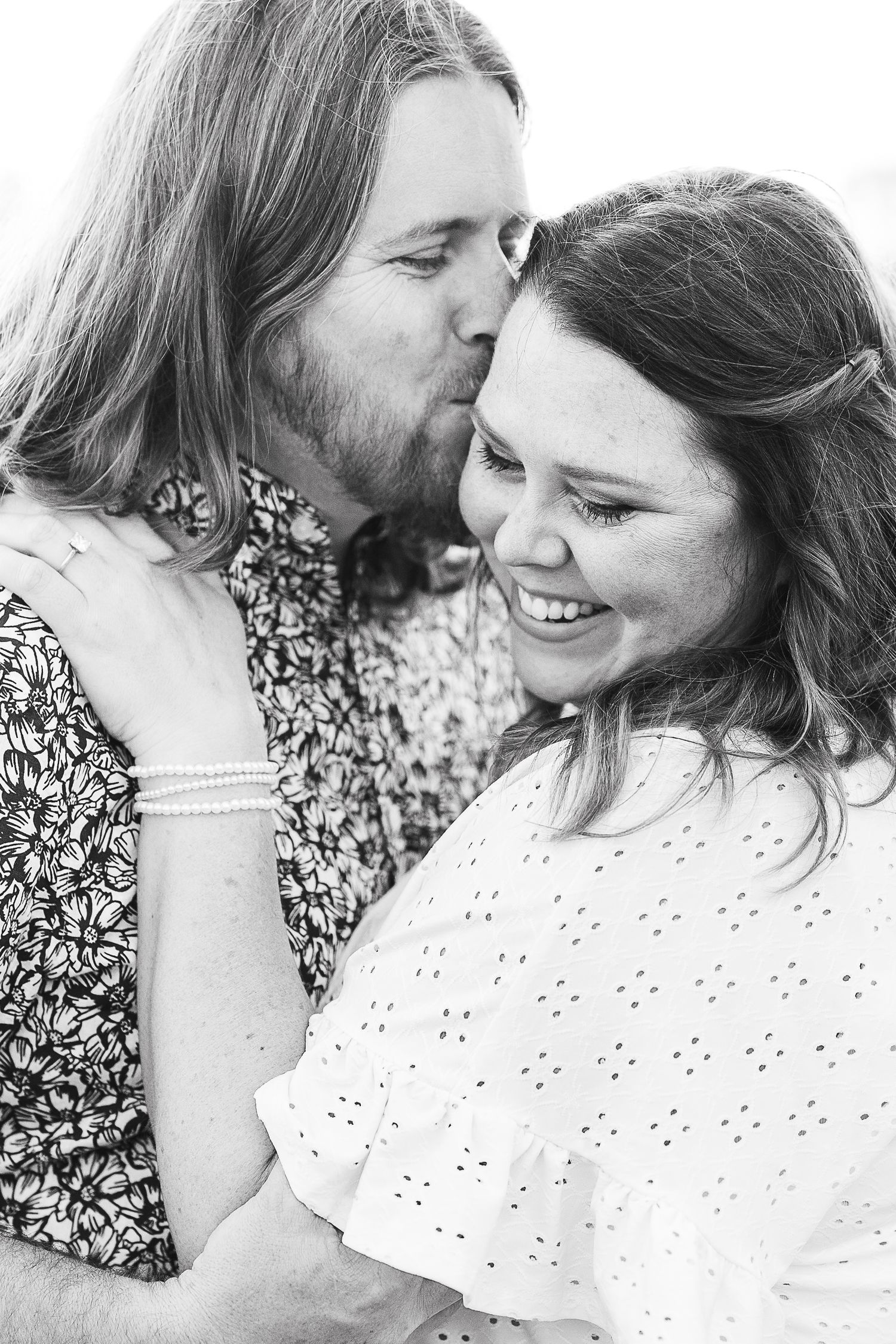 Engaged couple kissing during their Kenosha engagement session.
