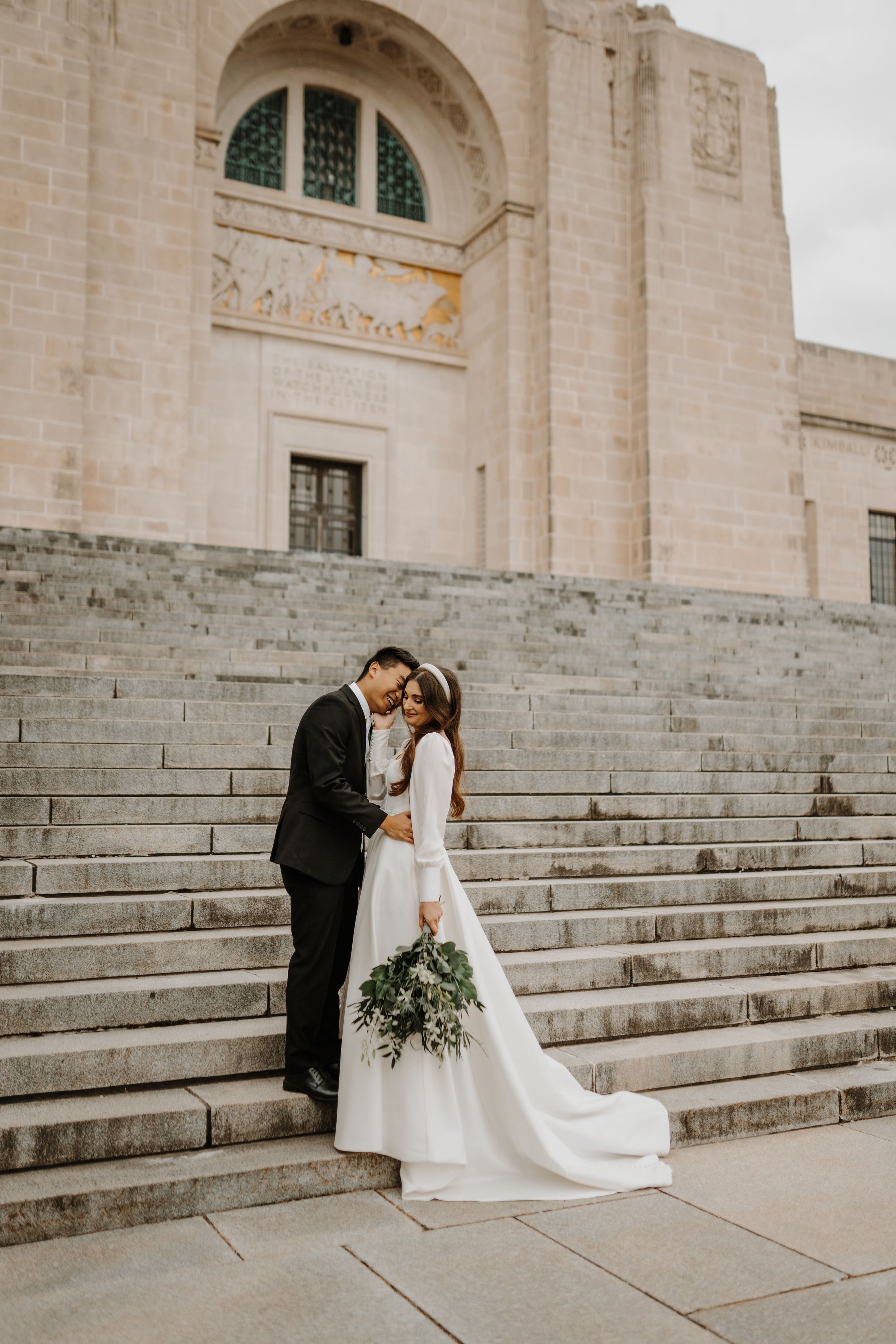 A romantic wedding photo series showing a couple in elegant attire on grand stone steps of a historic building.