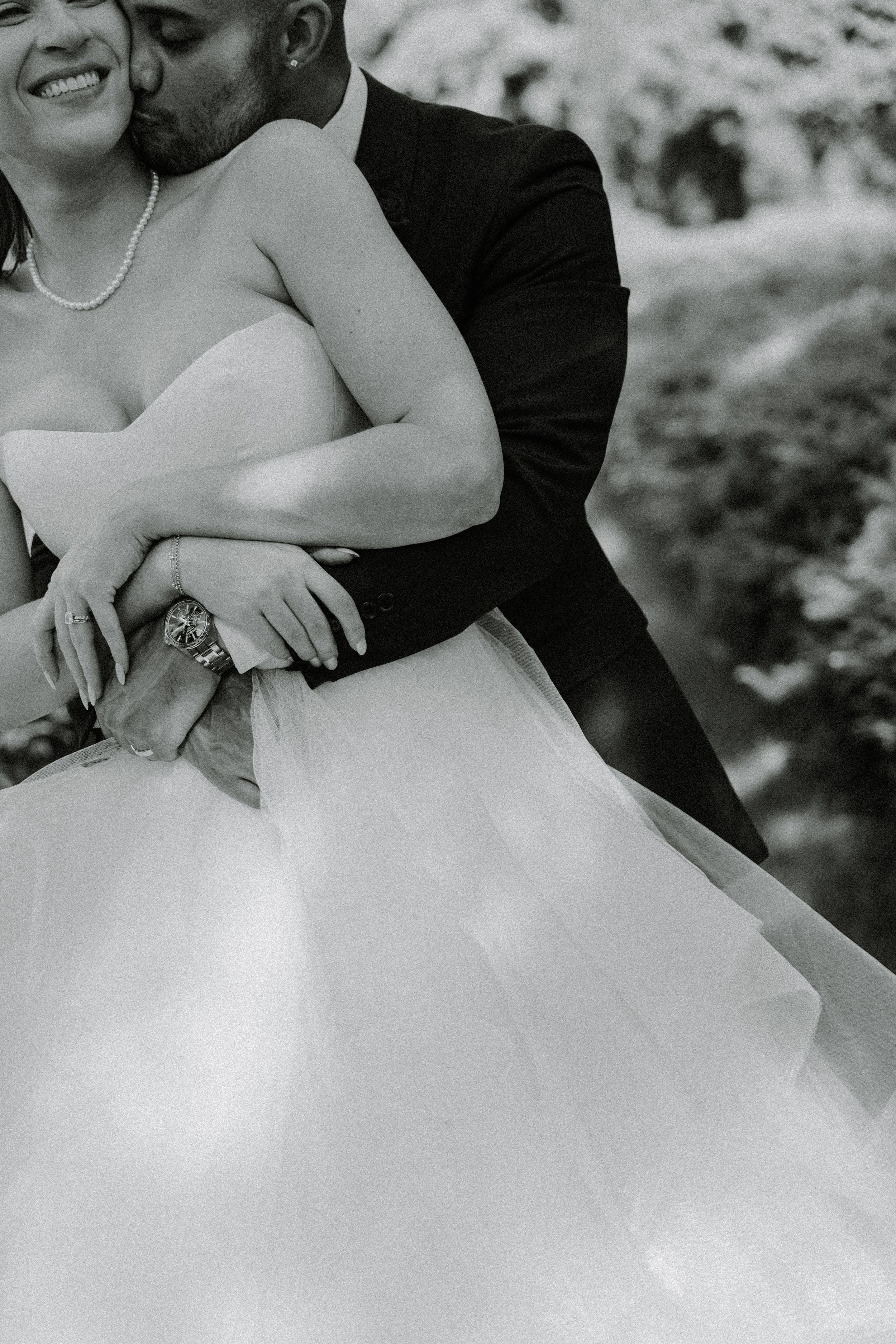 Black and white closeup shots capturing bride's details in wedding dress.