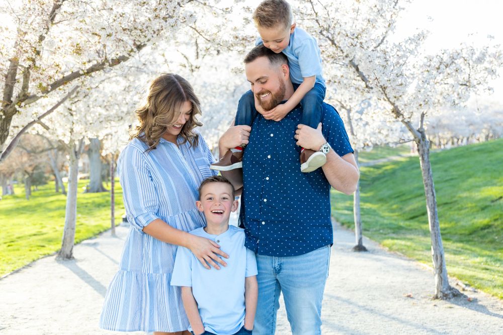 Family photo at the Utah State Capitol with blossoms
