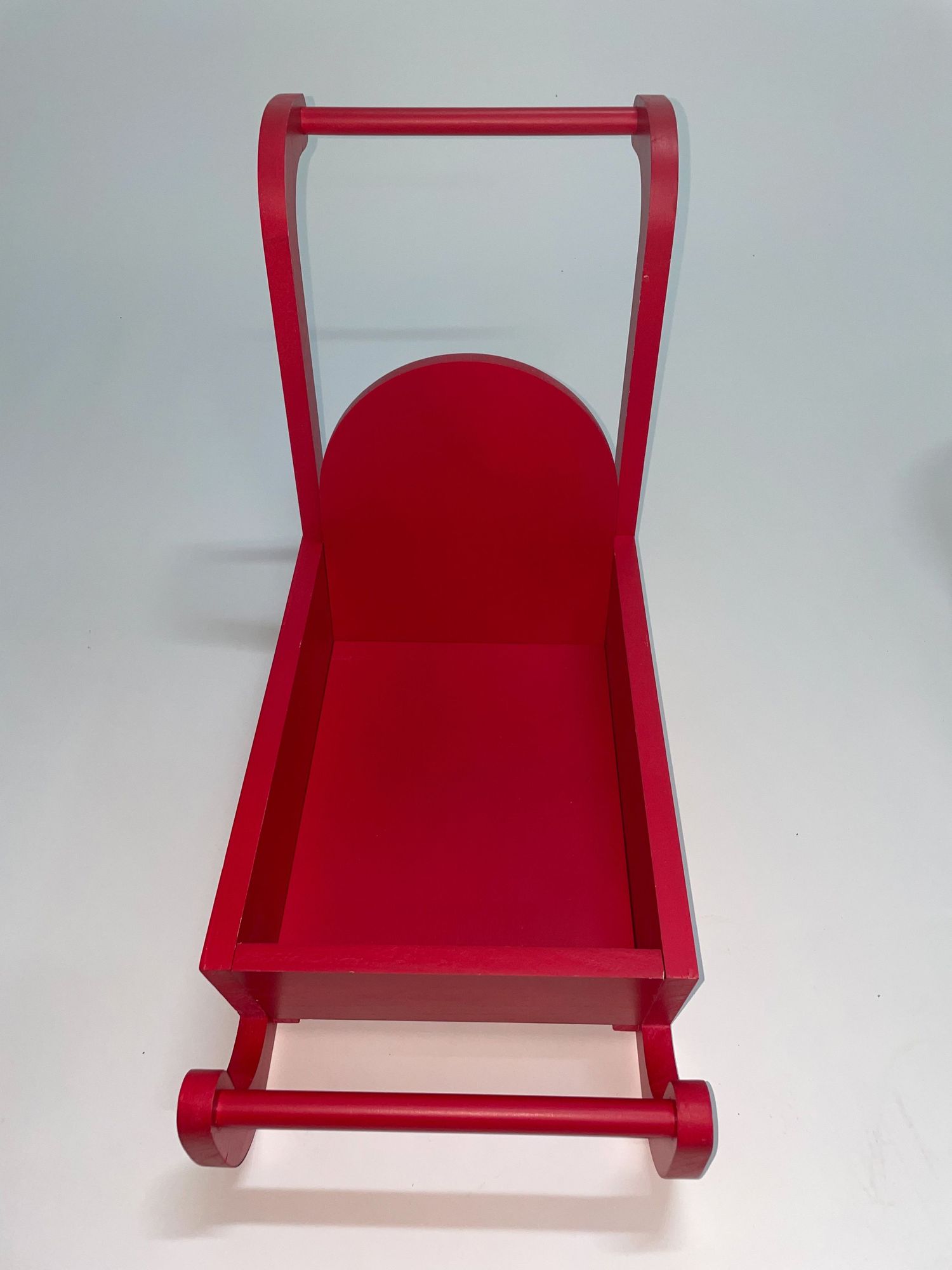 Red wooden doll cart or toy wagon displayed from different viewing angles.