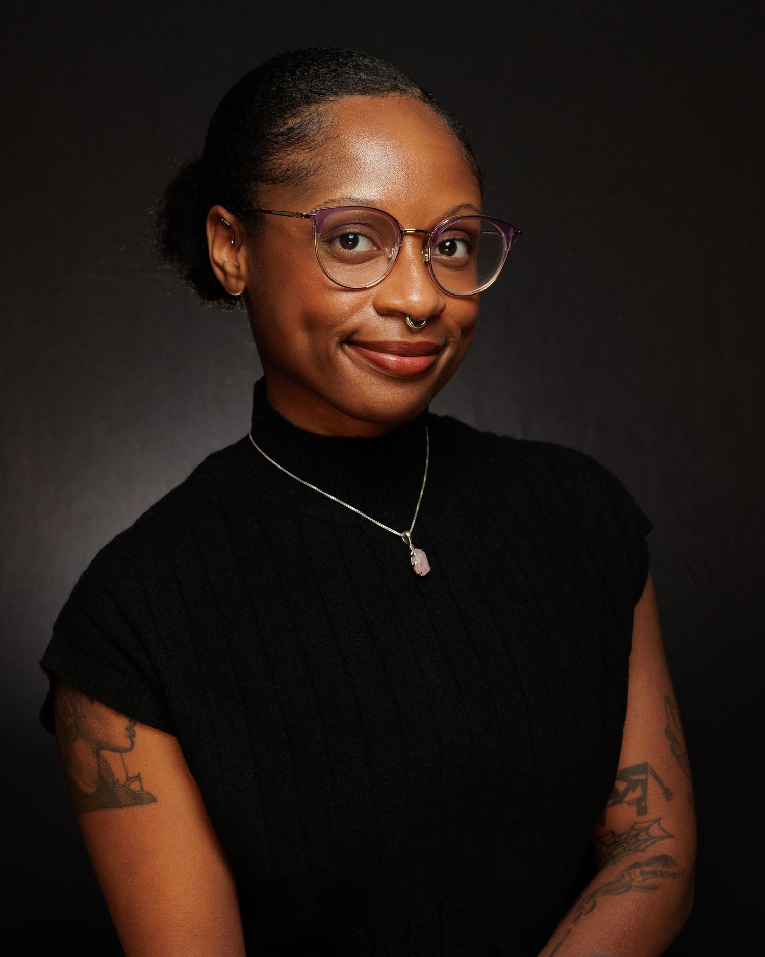 A professional headshot photo of Newburgh based wedding and portrait photographer, Sasha Pierre-Louis