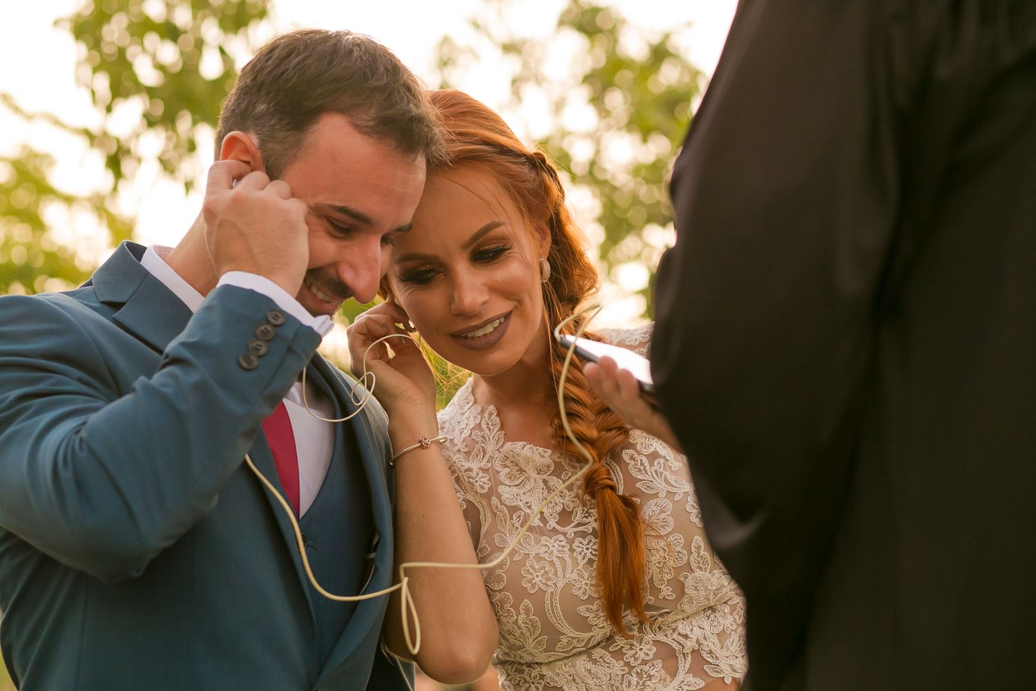 An emotional moment shared between newlyweds during their outdoor ceremony.