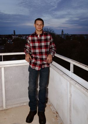 A white railed observation deck against an evening sky.