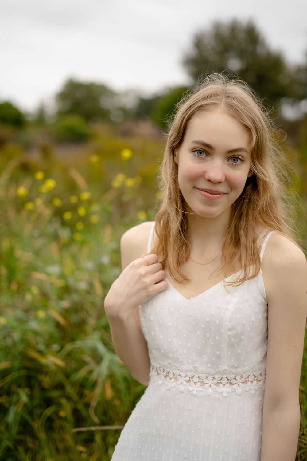 A series of portraits featuring someone in a white lace dress against a natural background.