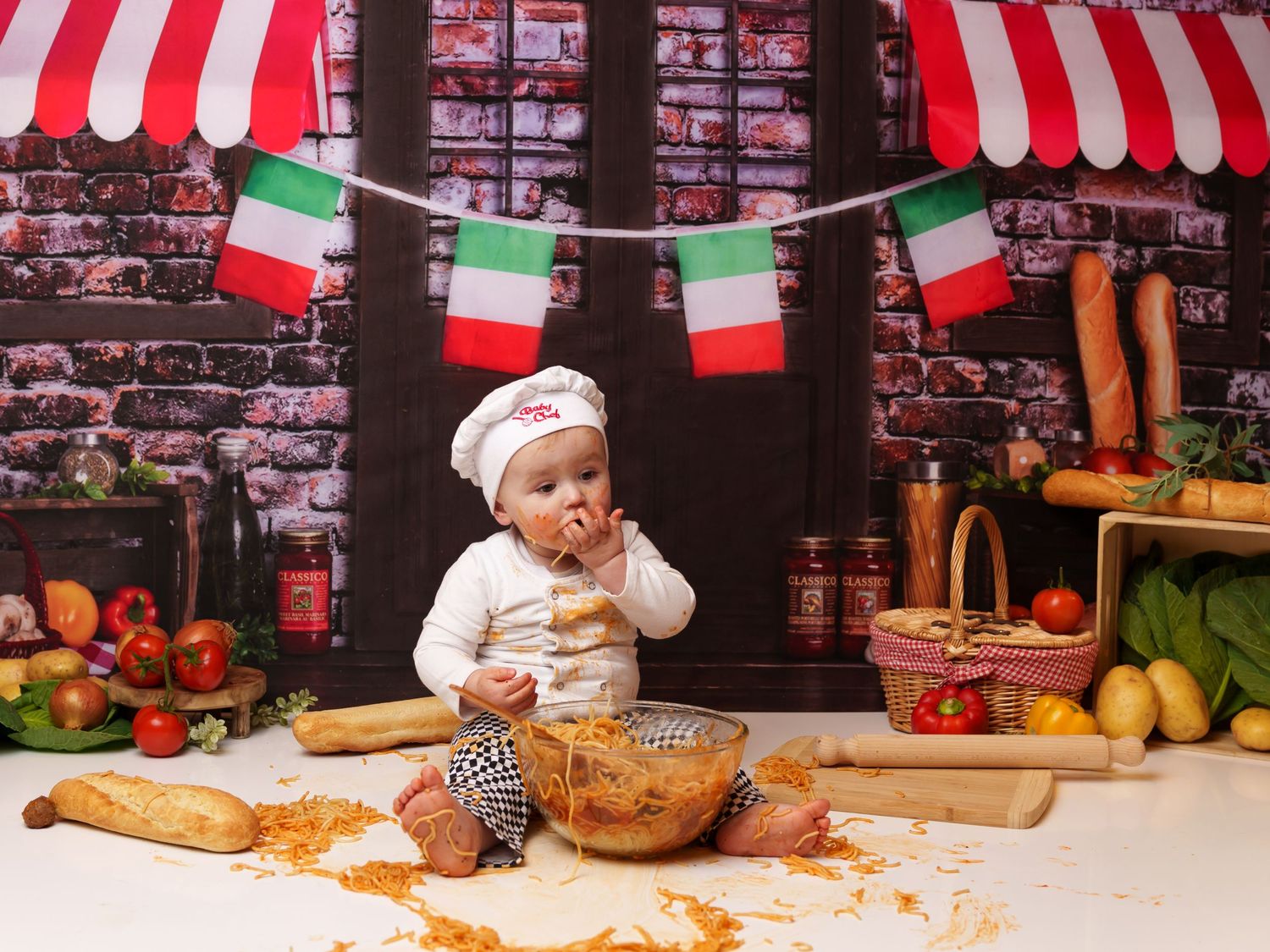 Playful spaghetti smash photography session in Italian bistro setting.