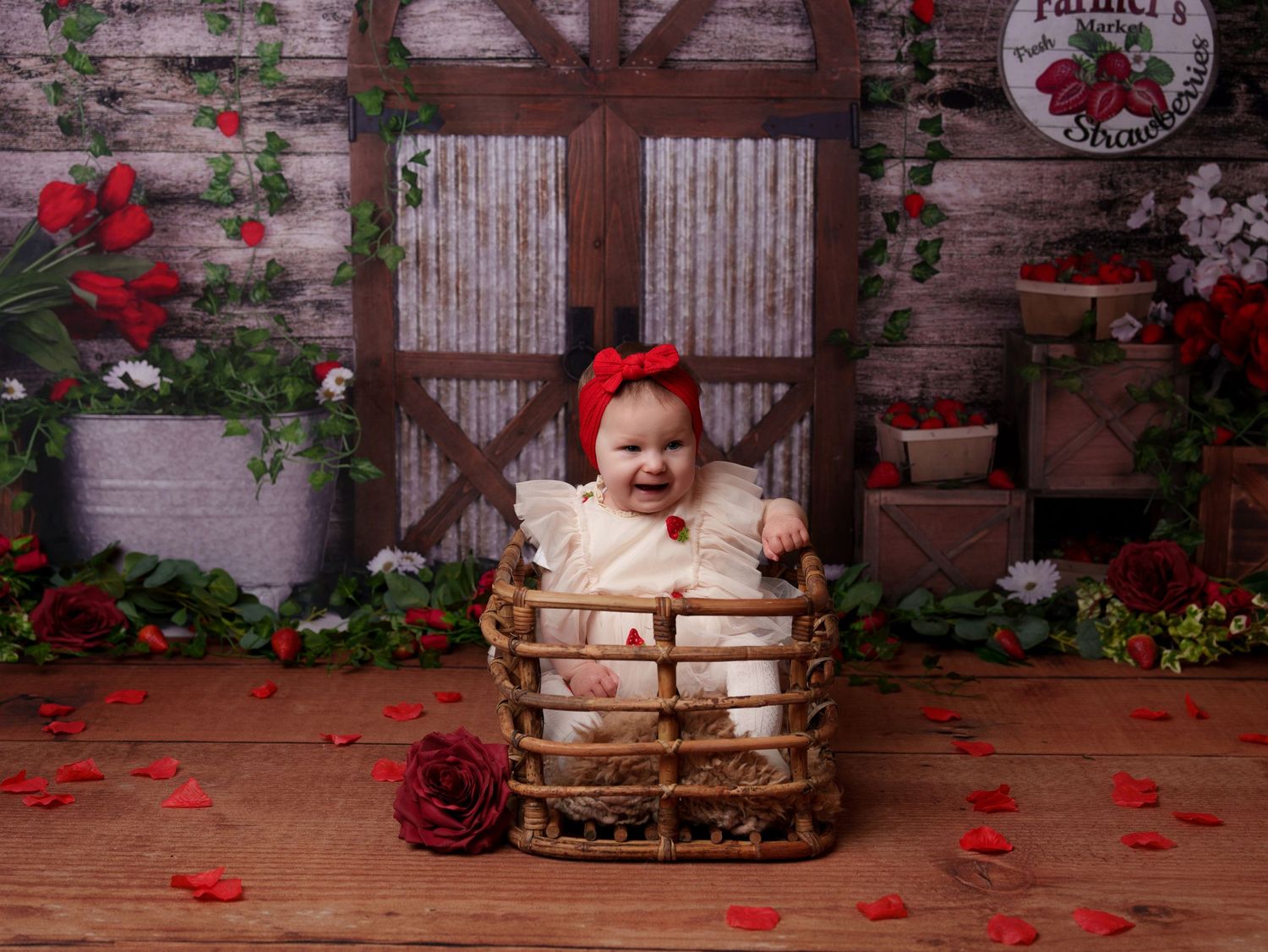 Wooden basket photo setup with barn door backdrop and climbing roses.