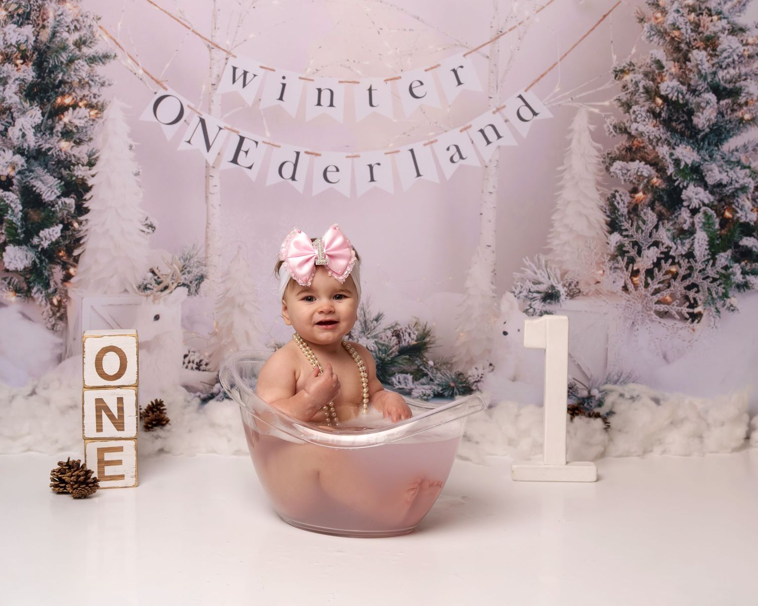 Cozy winter wonderland themed bath setup with ONE blocks and frosted trees.