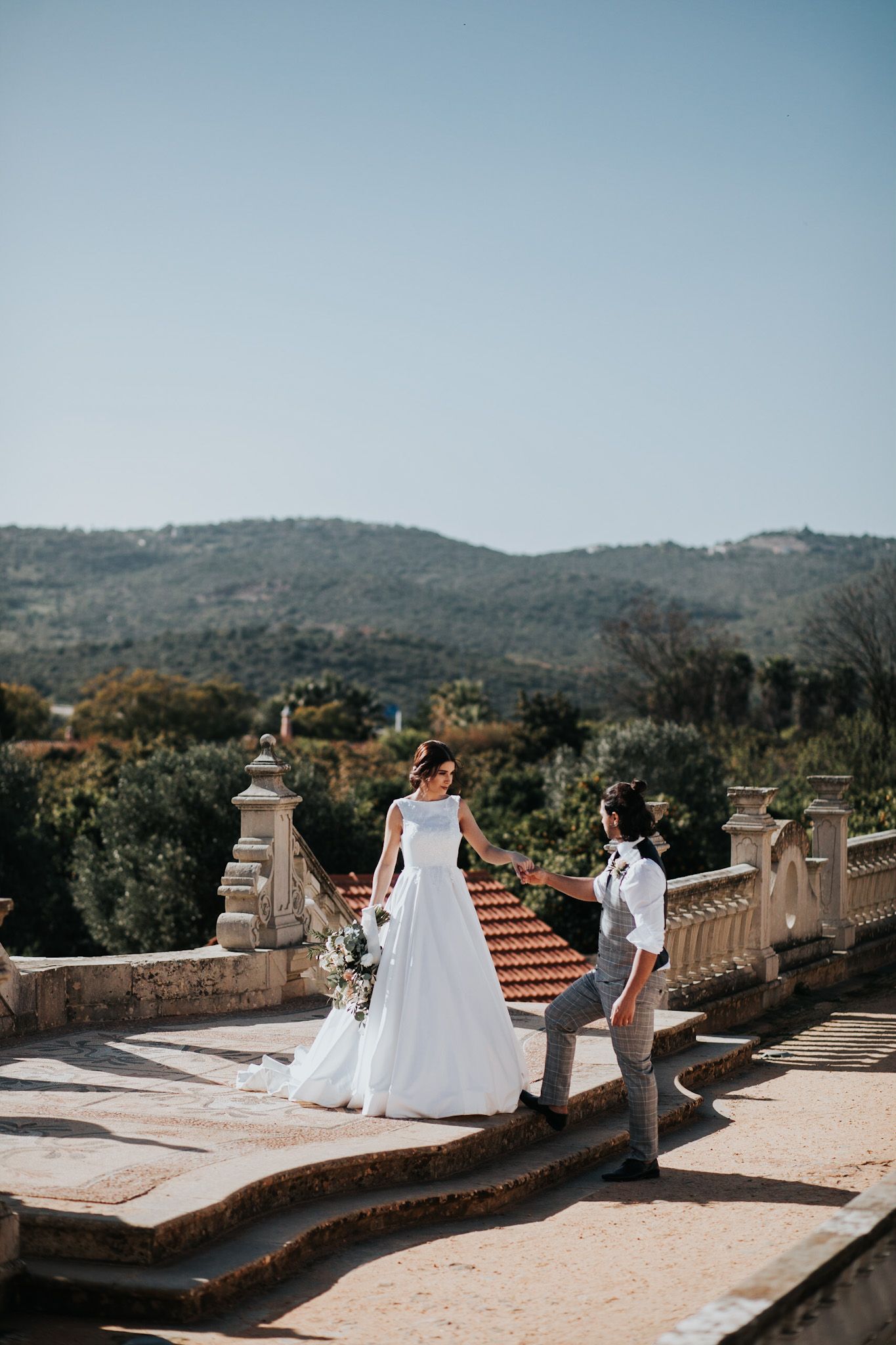 wedding couple in Portugal wedding venue holding hands
