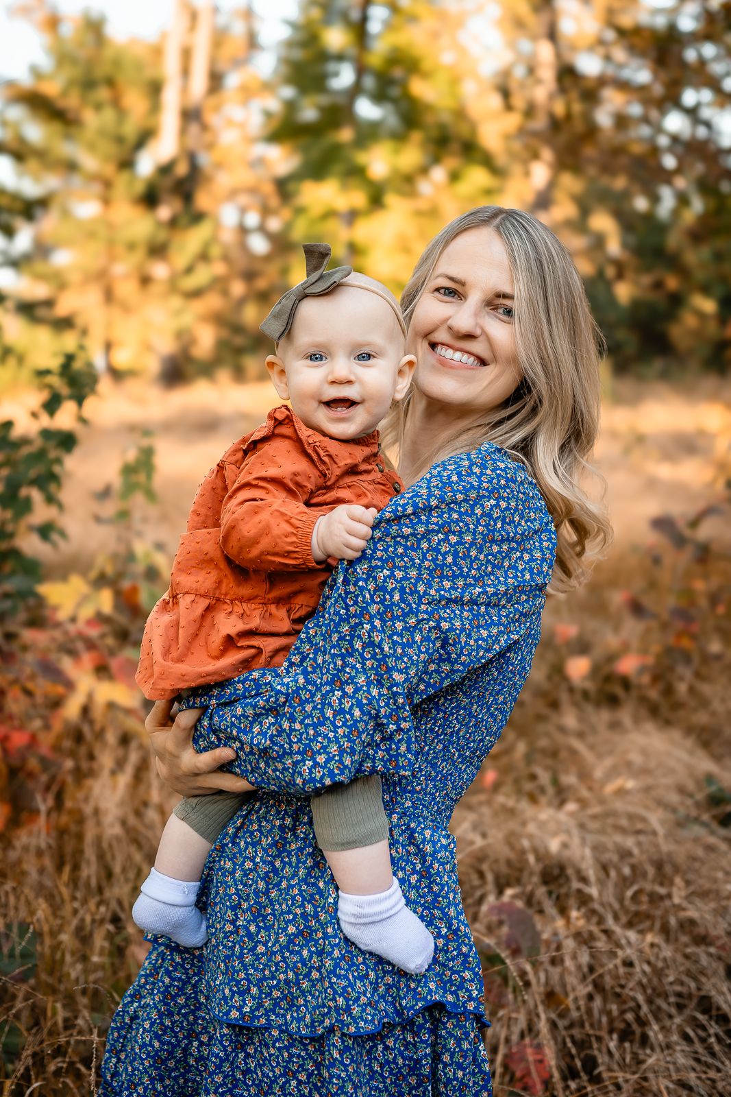 A touching autumn portrait showing tender family moments surrounded by golden foliage.