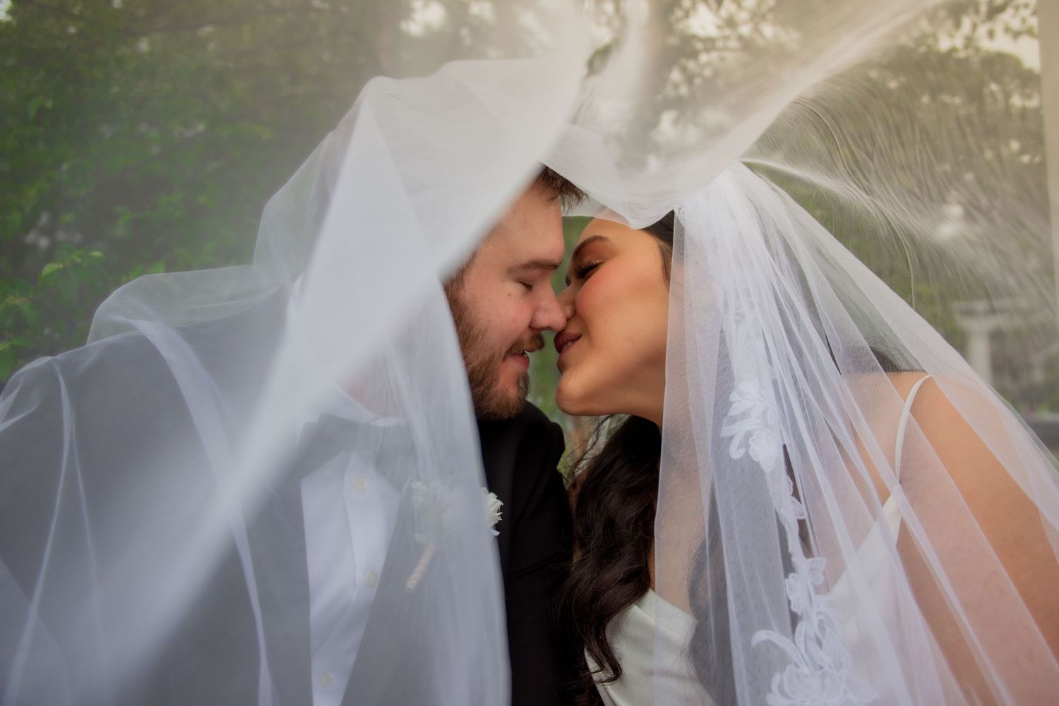 Bride and Groom artistic photo kissing