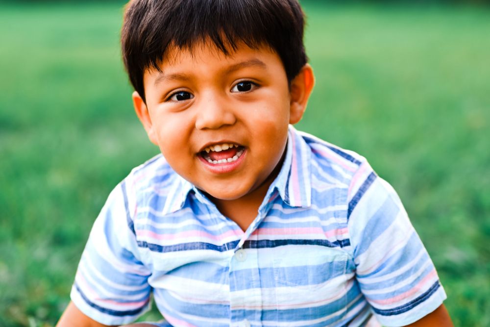 Little boy smiling at Melissa J. Conwell Photography photographer