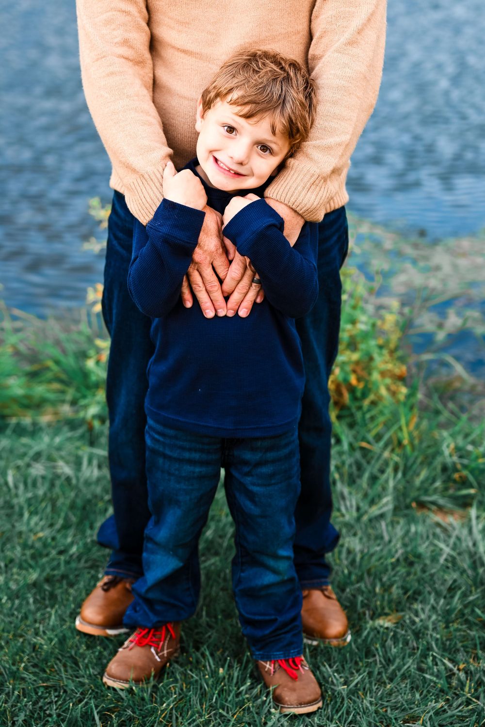 Little boy hugging Daddy.