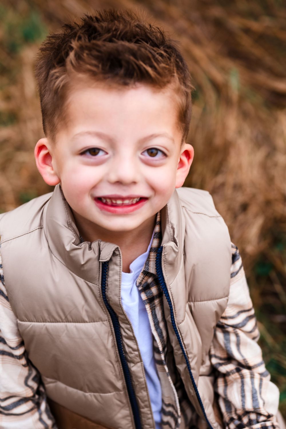 Little boy smiling at Melissa J. Conwell Photography photographer