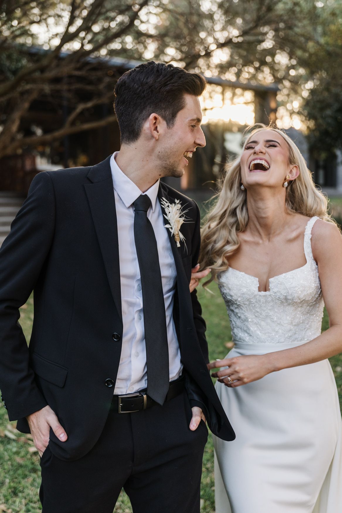 Wedding couple dancing at sunset