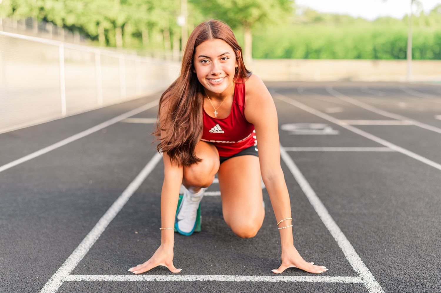 Senior girl on high school track.