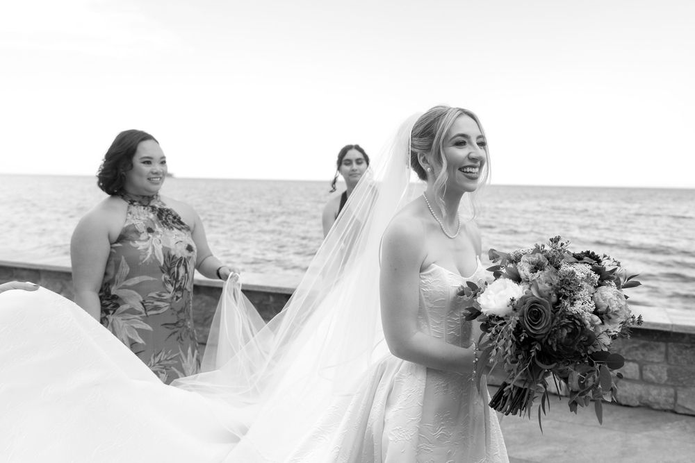 Series of candid bridal portraits showing joyful moments by the ocean with flowing veil and bouquet.