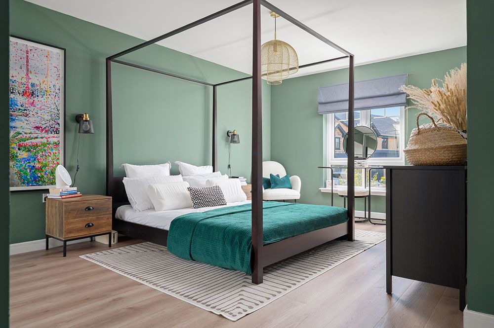 Modern bedroom interior with teal accent wall, black metal bed frame, and minimalist decor in a contemporary design style.
