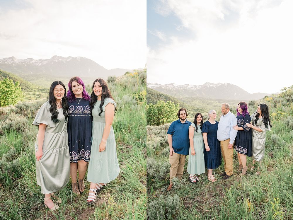 Family group poses together on grassy hillside with mountain backdrop on sunny afternoon in Utah.
