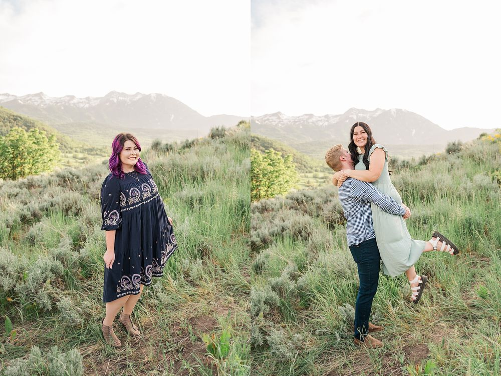 Family enjoying a playful moment together on a grassy hillside with mountains in the background during sunset.
