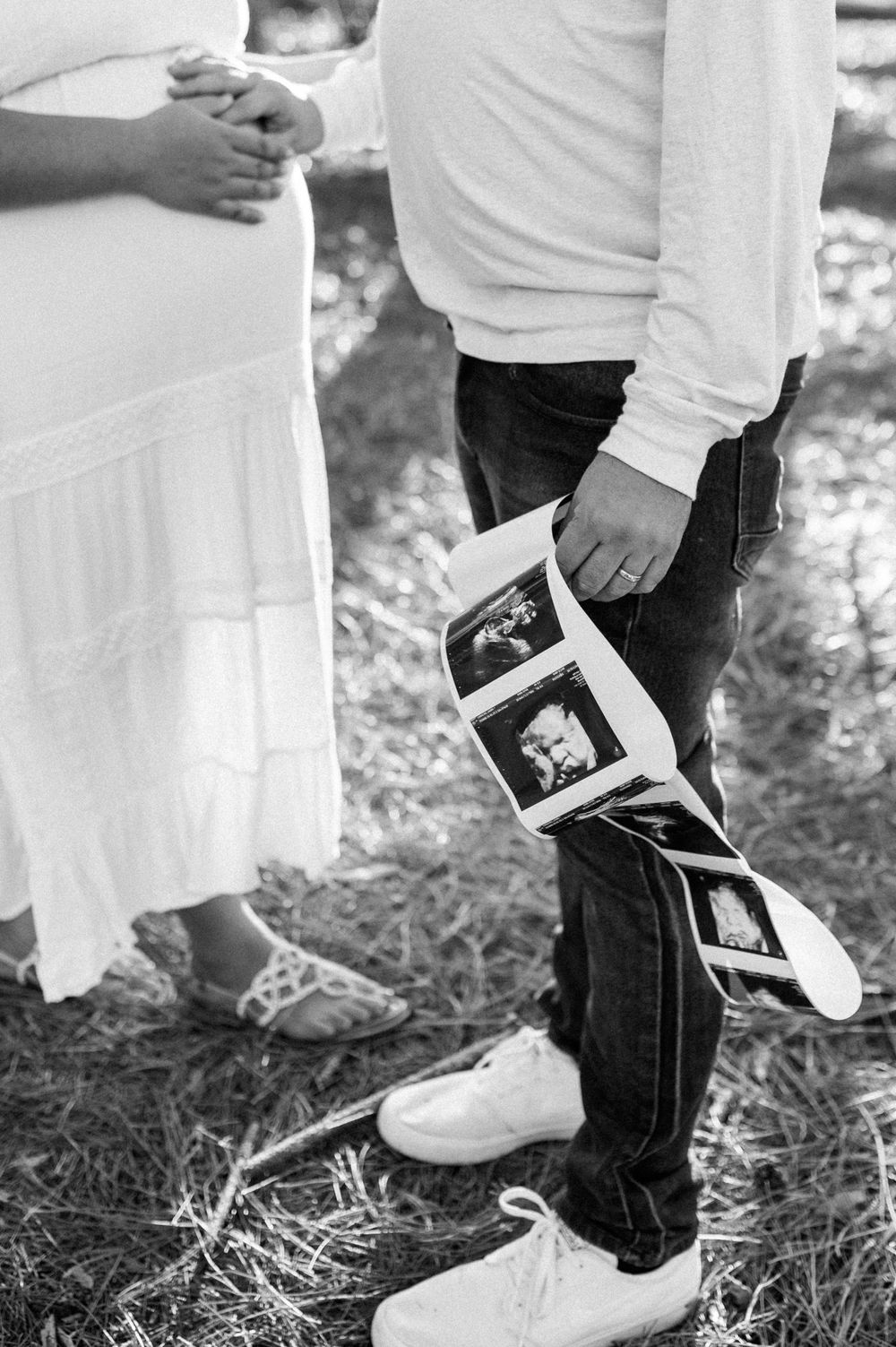 Black and white detail shots of feet and sonogram photos during maternity session.