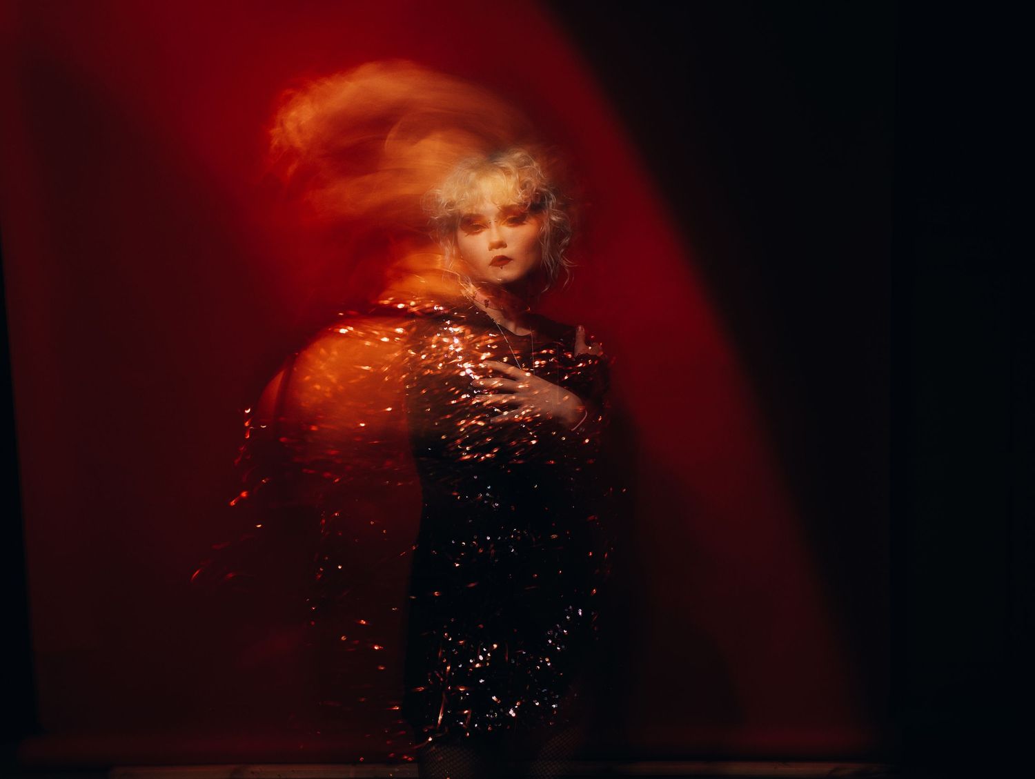 girl in a photo studio in Vilnius in a shiny dress. studio photo shoot in Vilnius