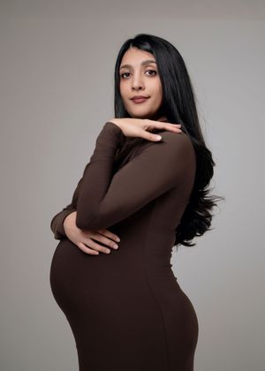Person in brown turtleneck sweater poses in sequence showing different angles against gray background.