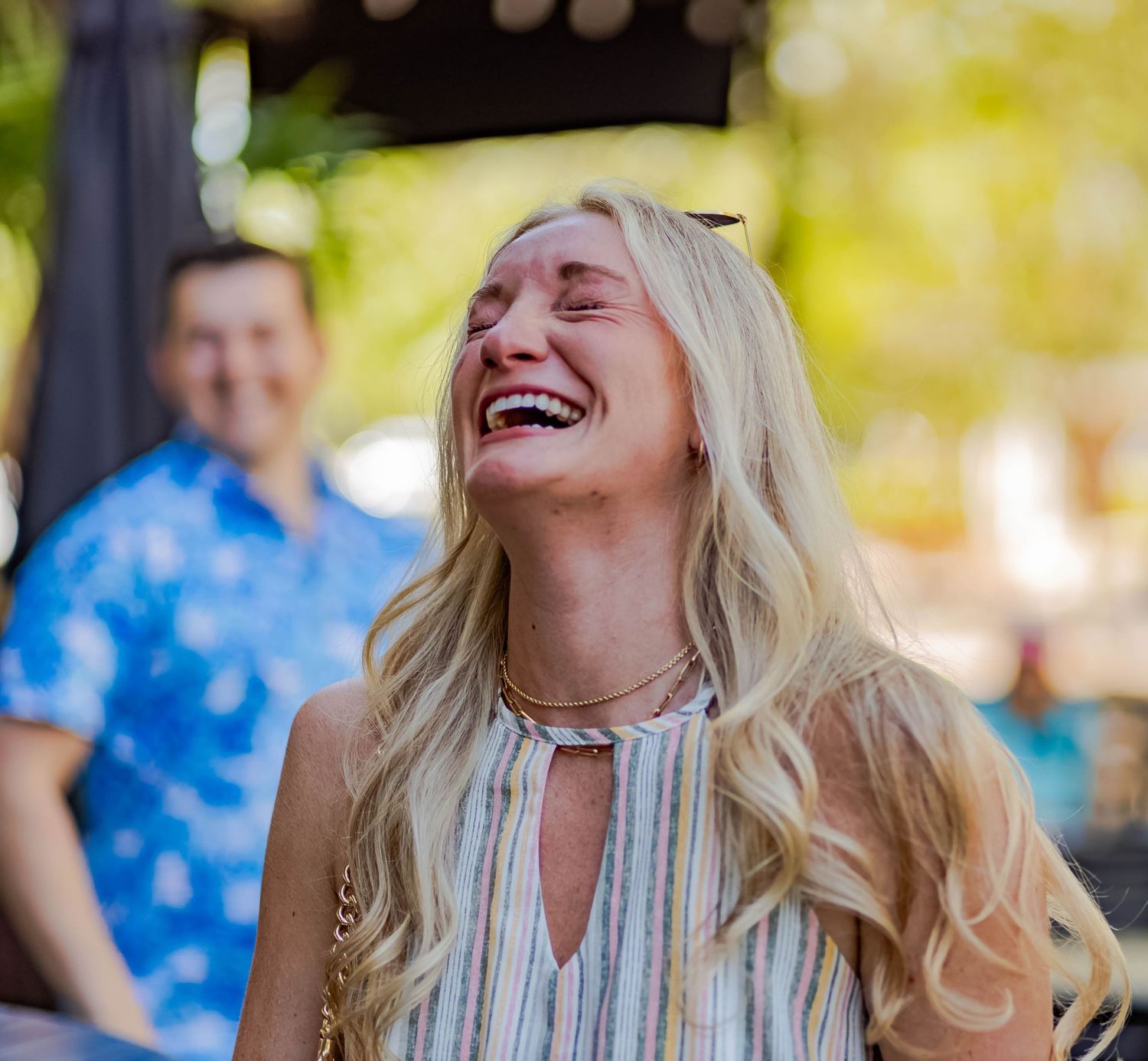 A joyful reaction captured during a outdoor surprise moment.