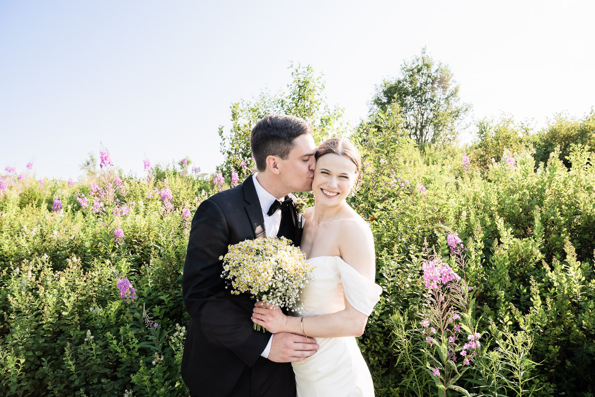 A couple standing at Signal Hill, with the bride lovingly saying, 'This is my man,' Signal hill St. John's, Newfoundlan