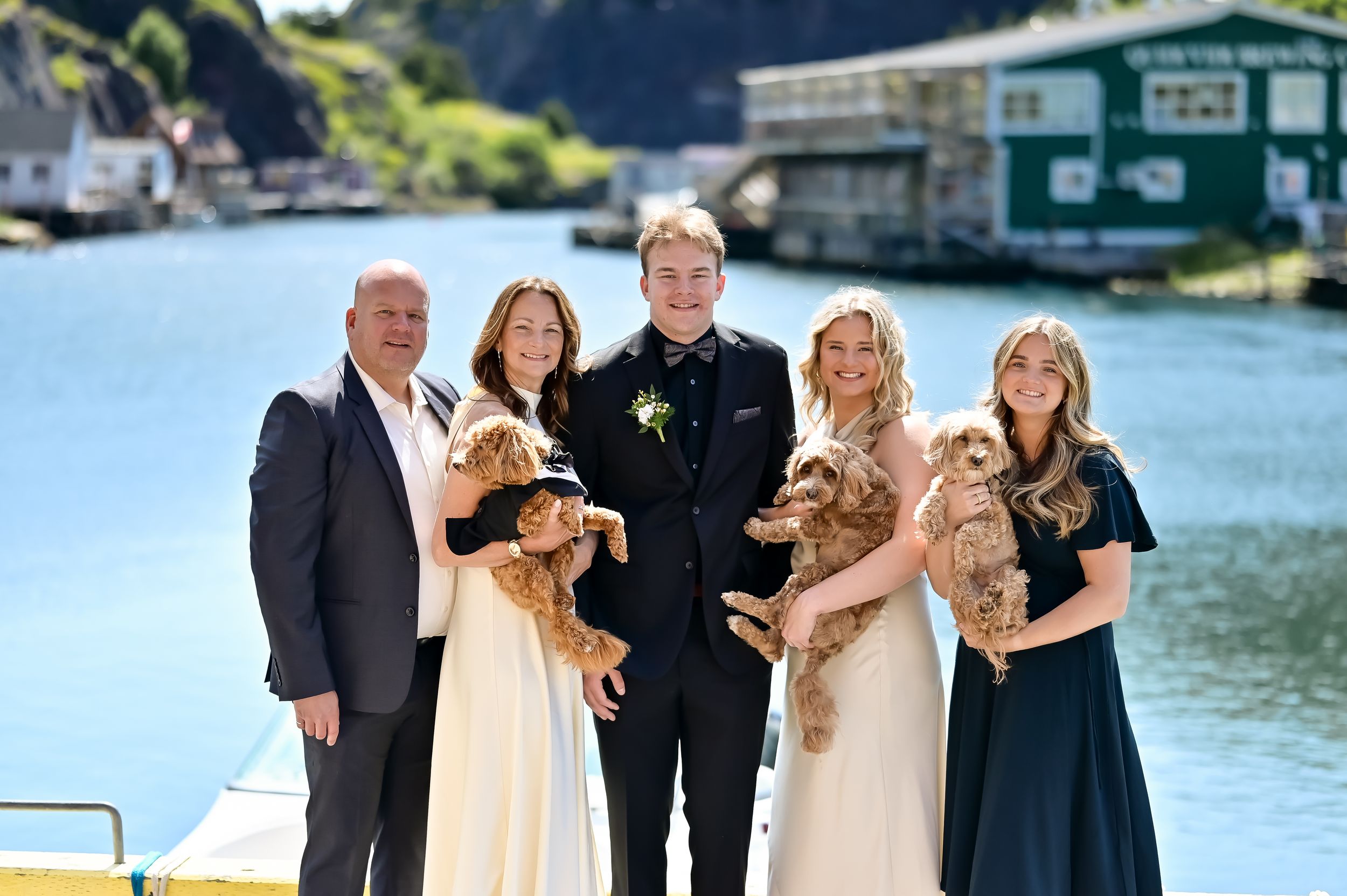 Prom day family photo with daughter in prom dress and family dogs in Quidi Vidi