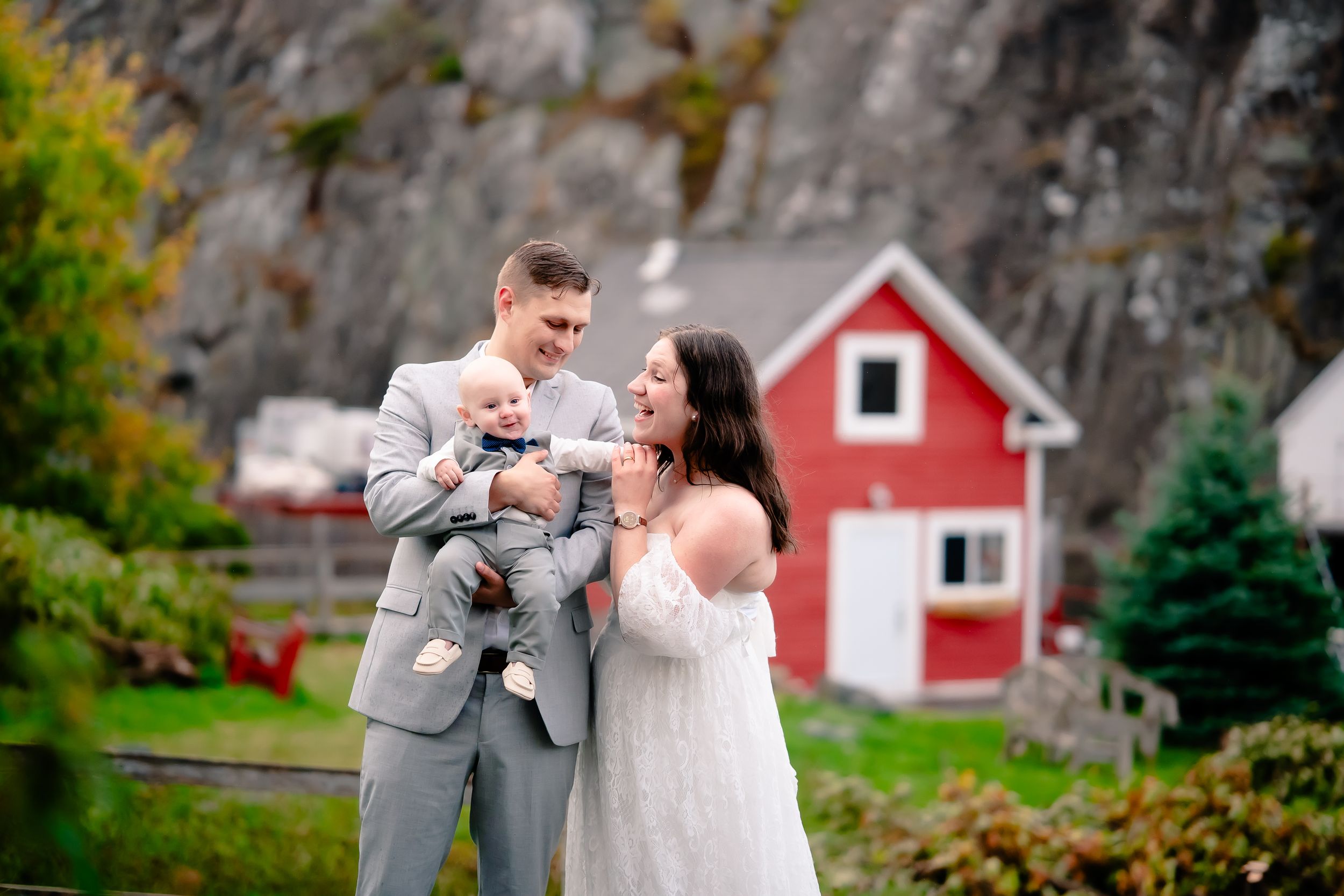 Happy newlywed couple with their baby during family portrait session in St. John’s Newfoundland
