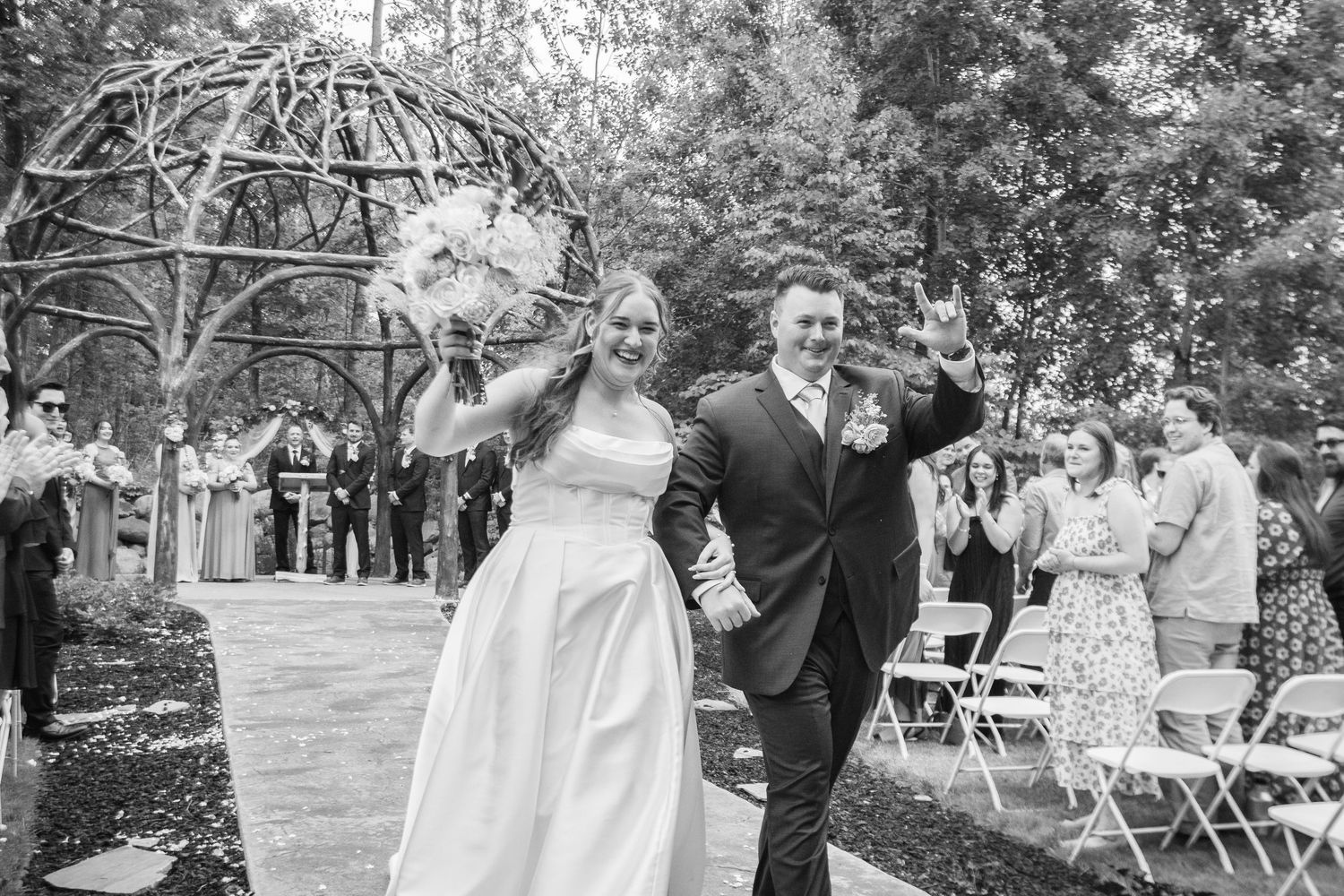 A series of black and white wedding photos showing outdoor ceremony moments and celebrations in a garden setting.