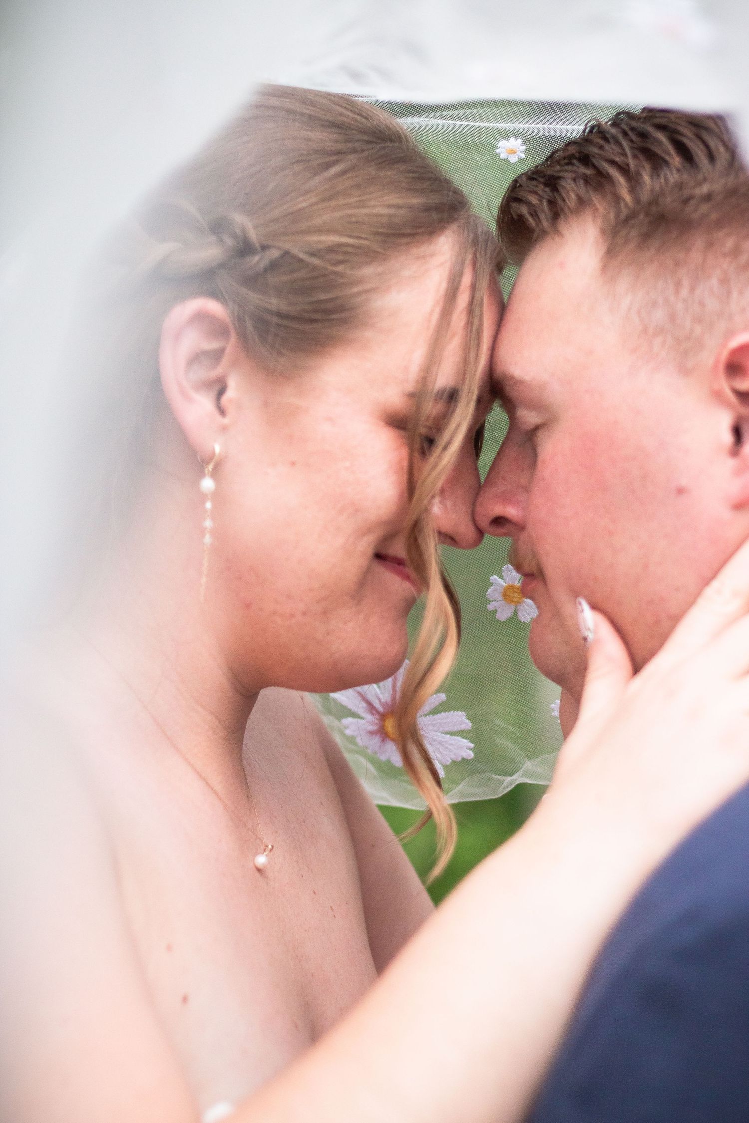 A romantic series of close-up shots showing a couple in an intimate moment with flowers in the background.