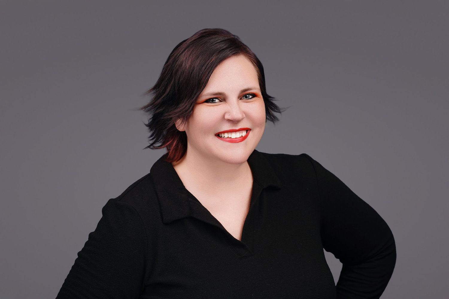 Daniella Koontz of Koontz Photography in a black outfit taken by Cona Studios