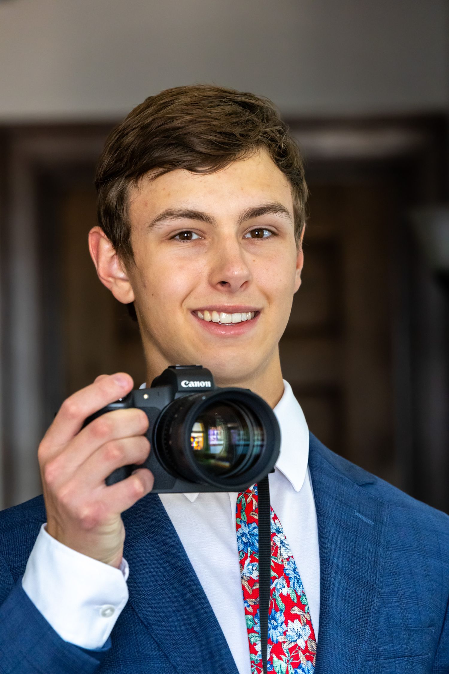 Portrait of man with camera