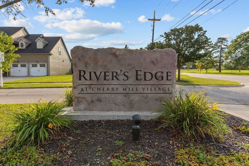 Stone entrance sign for River's Edge at Cherry Hill Village community.