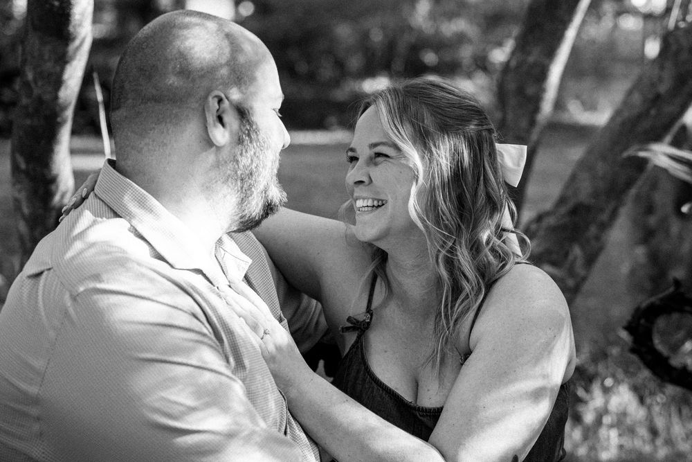 Black and white intimate portraits of a couple in a romantic outdoor setting.