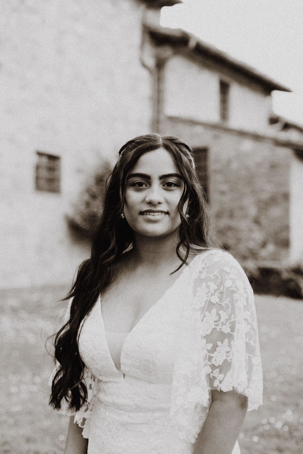 Black and white portrait series featuring a white lace dress with short sleeves.
