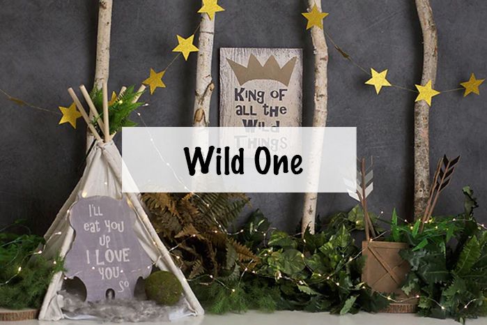 Dark backdrop with gold stars and crown decorations against chalkboard background.