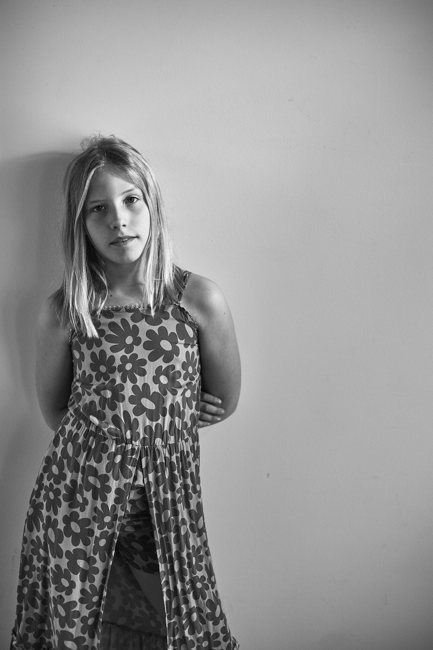Monochrome series showing movement and expression in a floral print dress.