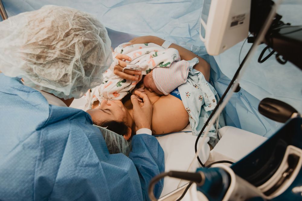 Medical procedure being performed by healthcare professional in sterile environment.