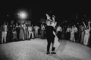 A series of black and white wedding reception photos showing dance floor celebrations and guests mingling at night.