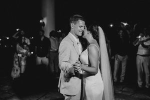 A black and white photo collage showing couples dancing at a wedding reception in low lighting.