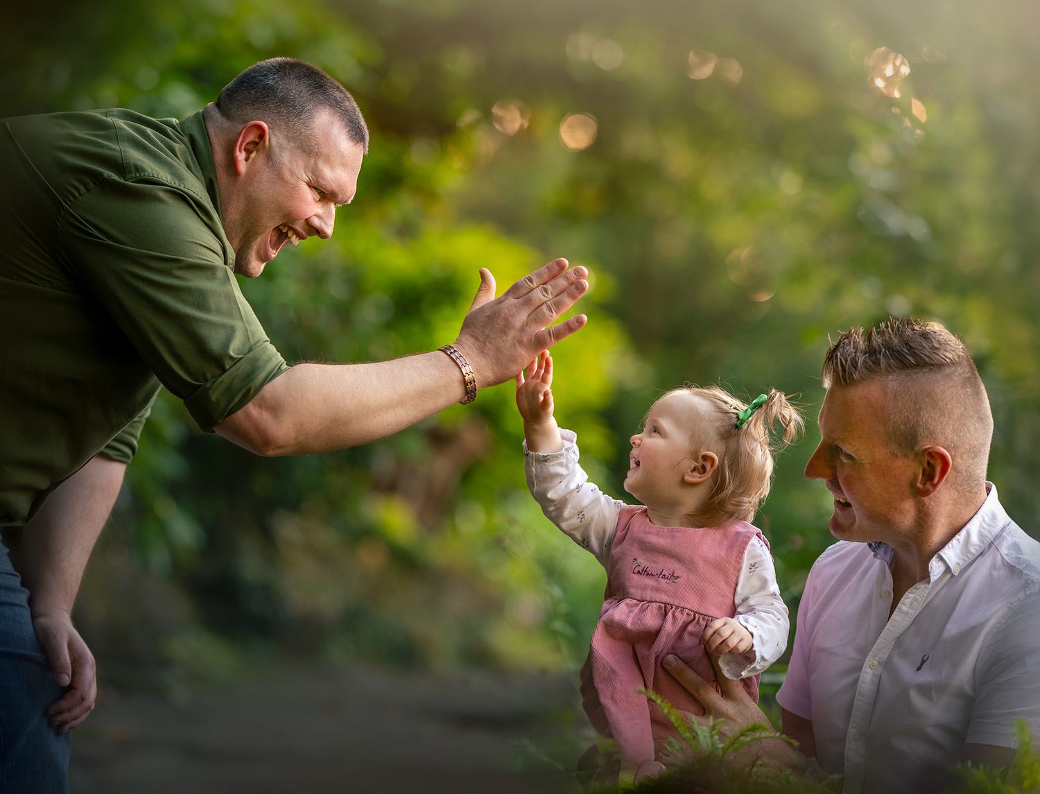 dads with little girl high five family portrait