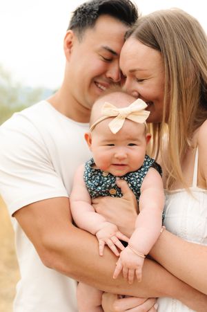 A collection of intimate family portraits captured outdoors in natural lighting.