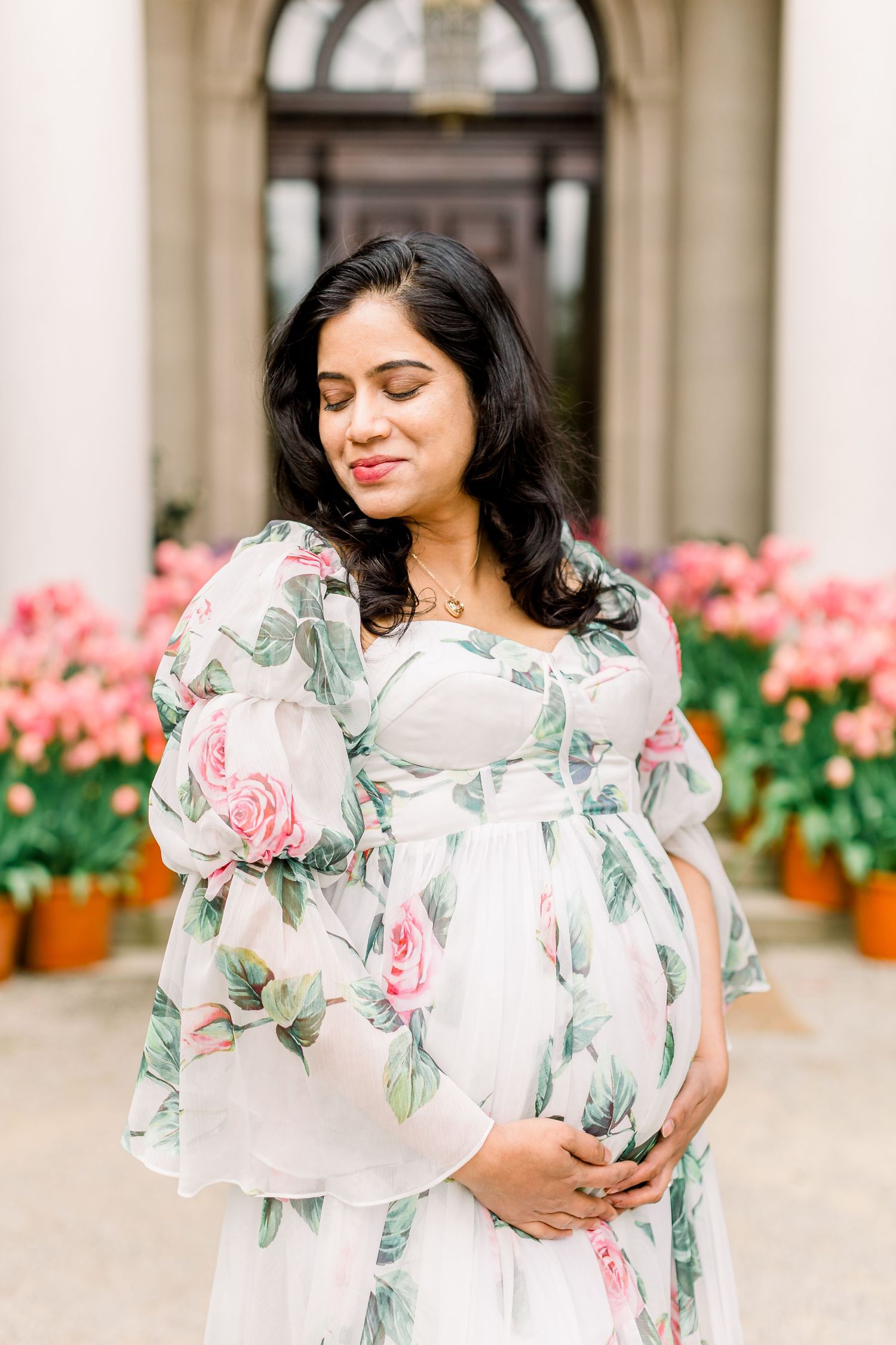 Maternity photo session in a garden full of flowers. Gamble Garden in Palo Alto, CA.