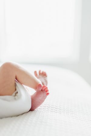 Posed Newborn Photographer based in Denver Colorado offering in Studio Newborn Photo sessions. Centennial Colorado photography studio