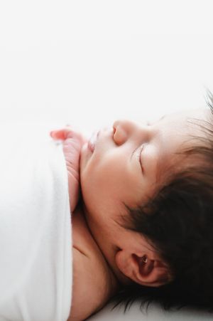 Newborn photography in studio of family and children based in Colorado including baby details