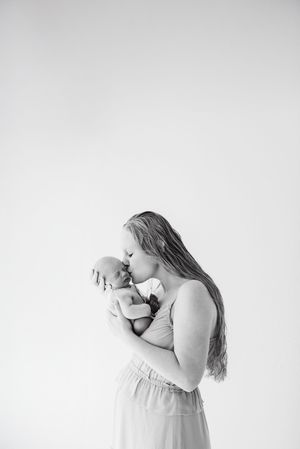 In studio newborn photographer for family and baby photos. Mommy and me photos with newborn at studio in Centennial Colorado